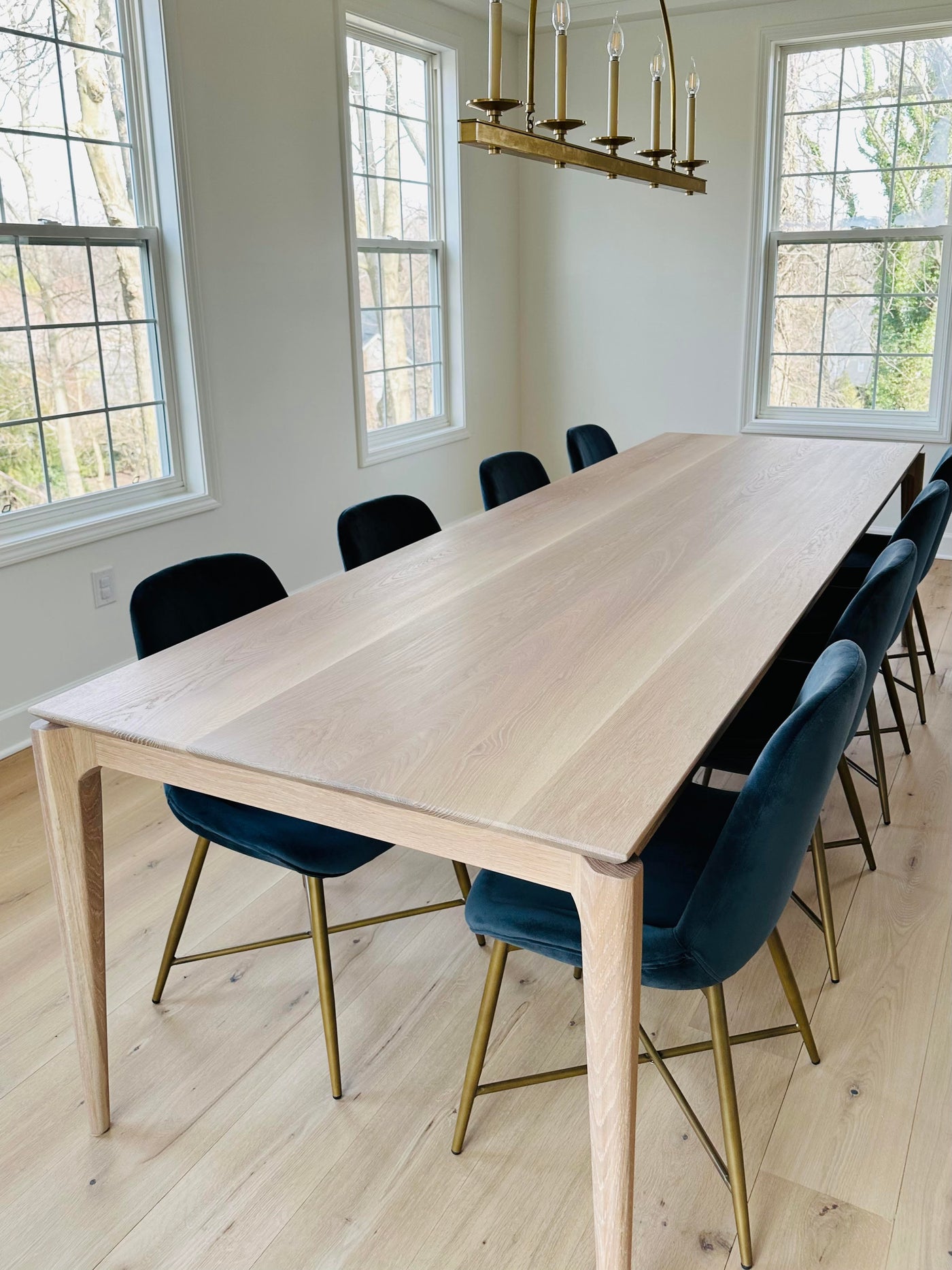 SARI in Walnut by Relic Table Co. handmade white oak dining table with 8 chairs modern dining room by interior designer